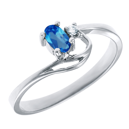 JCX302173: Genuine Blue Topaz 5x3 oval (December birthstone) set in 10kt white gold ring with .02ct round diamond accent.