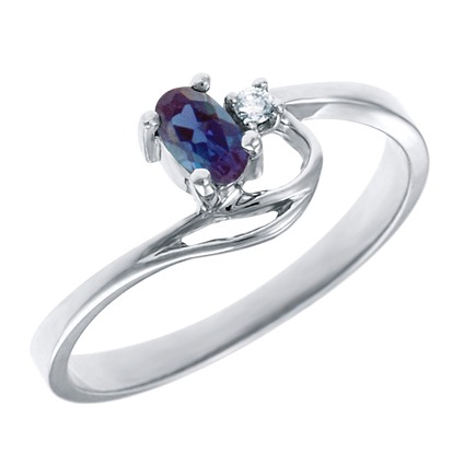 Created Alexandrite 5x3 oval (June birthstone) set in 10kt white gold ring with .02ct round diamond accent.