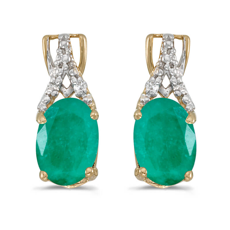 These 14k yellow gold oval emerald and diamond earrings feature 7x5 mm genuine natural emeralds with a 1.12 ct total weight and sparkling diamond accents.