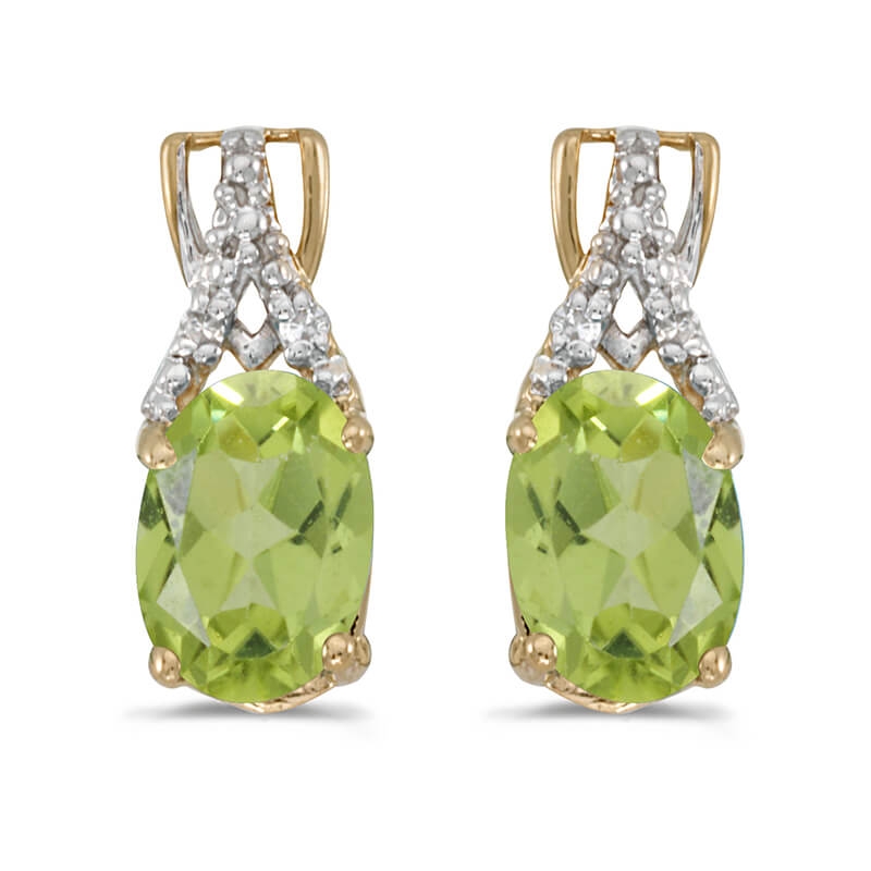 These 14k yellow gold oval peridot and diamond earrings feature 7x5 mm genuine natural peridots with a 1.34 ct total weight and sparkling diamond accents.