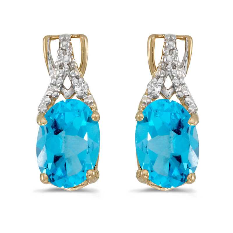 These 14k yellow gold oval blue topaz and diamond earrings feature 7x5 mm genuine natural blue topazs with a 1.32 ct total weight and sparkling diamond accents.