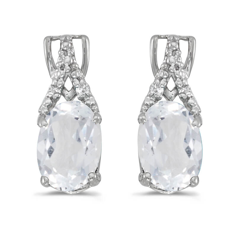 JCX2070: These 14k white gold oval white topaz and diamond earrings feature 7x5 mm genuine natural white topazs with a 1.84 ct total weight and sparkling diamond accents.