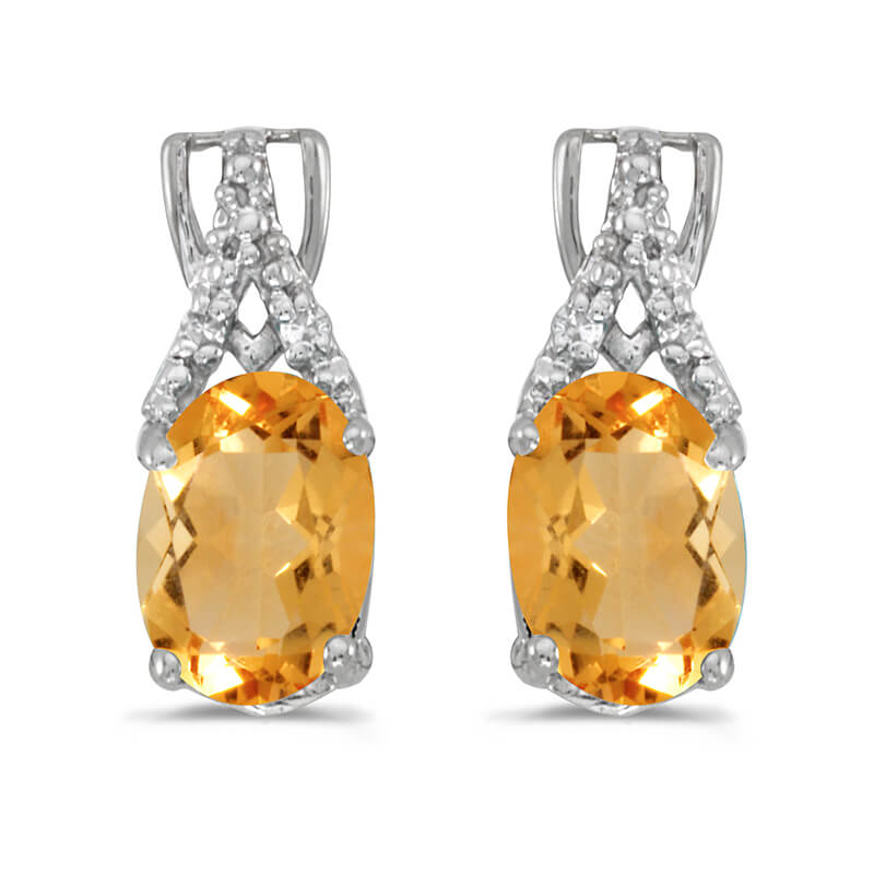 These 14k white gold oval citrine and diamond earrings feature 7x5 mm genuine natural citrines with a 1.28 ct total weight and sparkling diamond accents.
