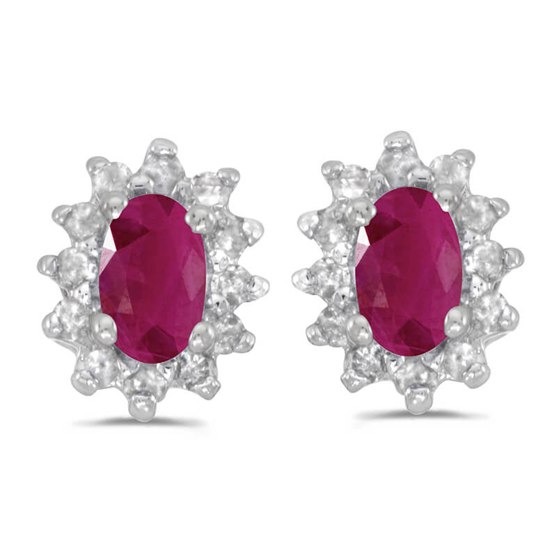 These 14k white gold oval ruby and .25 ct diamond earrings feature 5x3 mm genuine natural rubys with a 0.36 ct total weight.