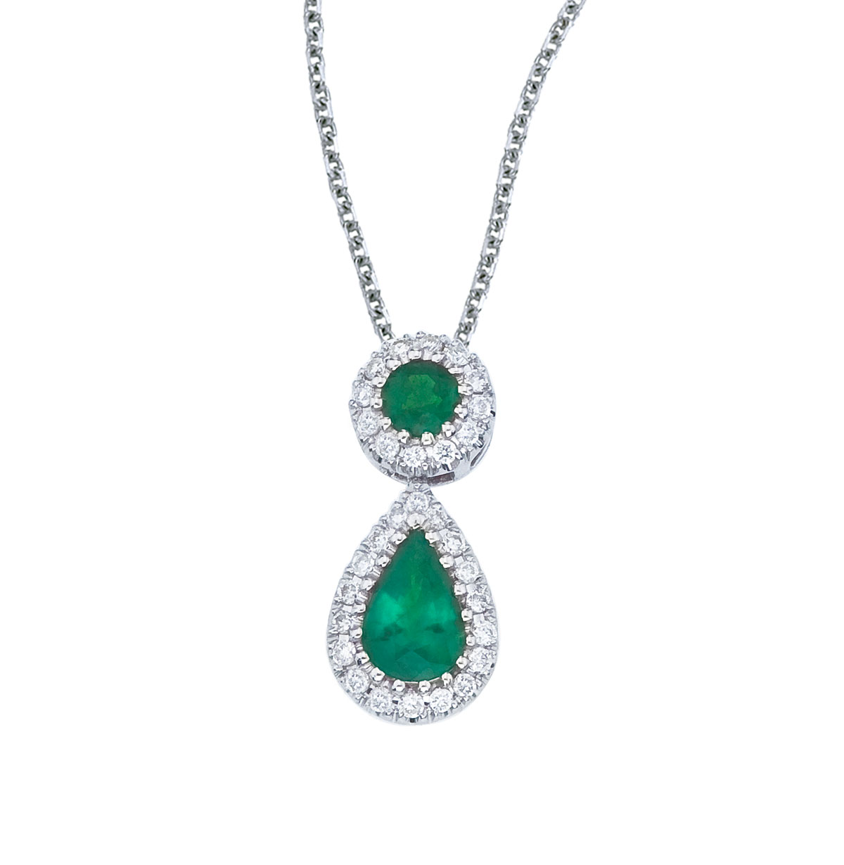 JCX2566: This beautiful 14k white gold pendant features a 6x4 mm emerald dangling from a 2.5 mm round emerald  all surrounded by .12 carats of shimmering diamonds.