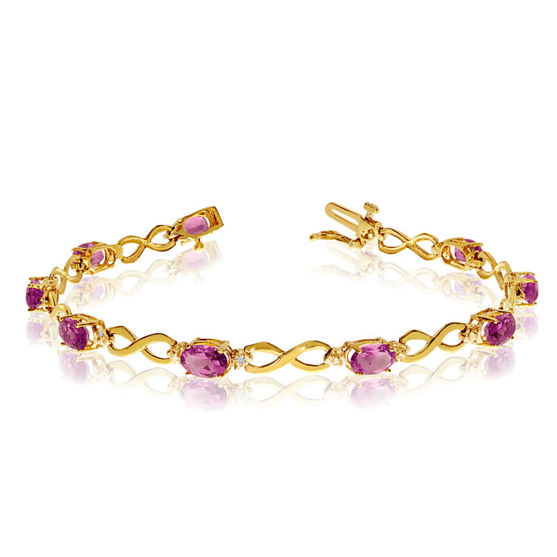 This 10k yellow gold oval pink topaz and diamond bracelet features nine 6x4 mm stunning natural pink topaz stones with a 3.87 ct total gem weight.
