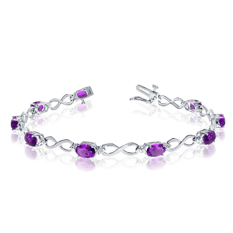 This 10k white gold oval amethyst and diamond bracelet features nine 6x4 mm stunning natural amethyst stones with a 3.06 ct total gem weight.