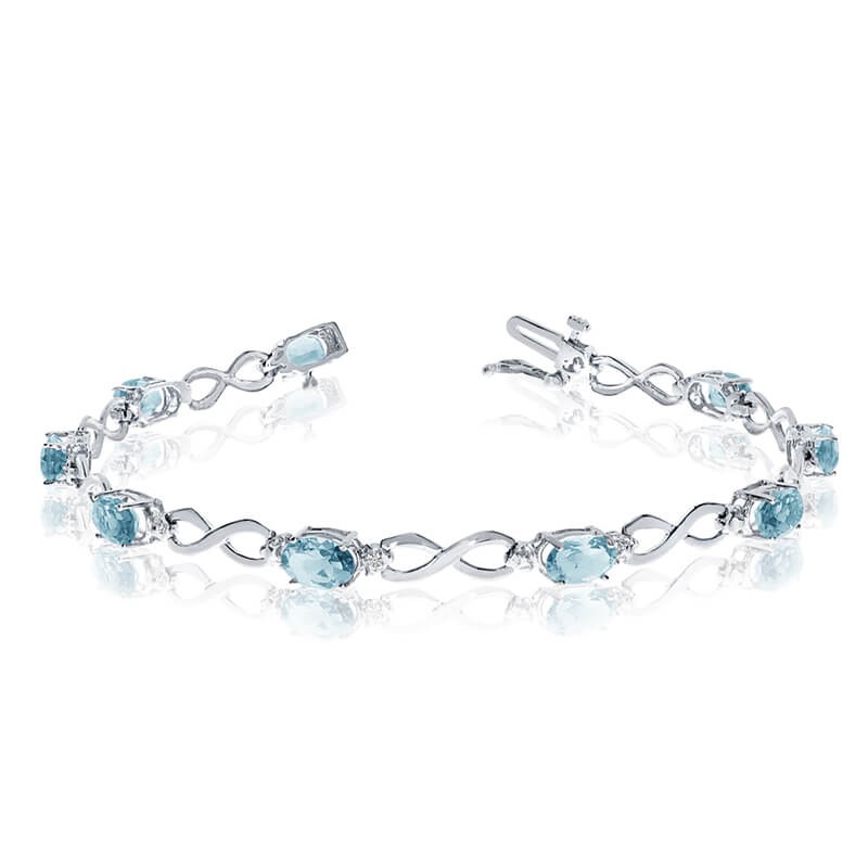 JCX3098: This 10k white gold oval aquamarine and diamond bracelet features nine 6x4 mm stunning natural aquamarine stones with a 2.61 ct total gem weight.