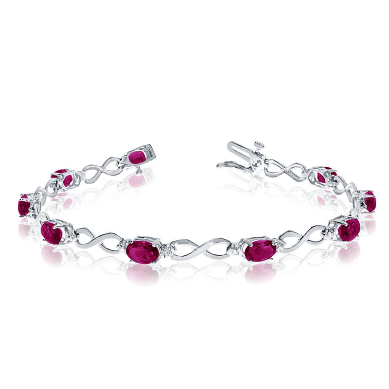 JCX3100: This 10k white gold oval ruby and diamond bracelet features nine 6x4 mm stunning natural ruby stones with a 3.24 ct total gem weight.