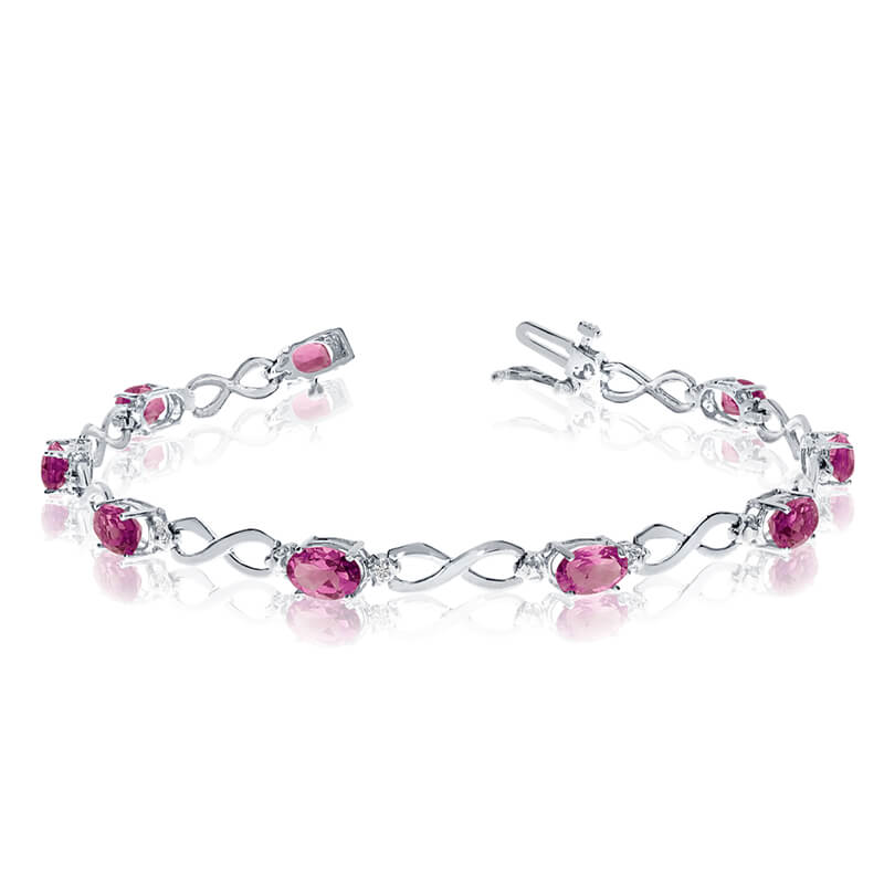 JCX3106: This 10k white gold oval pink topaz and diamond bracelet features nine 6x4 mm stunning natural pink topaz stones with a 3.87 ct total gem weight.