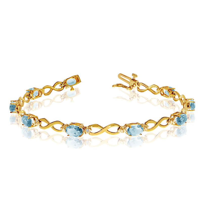 JCX3109: This 14k yellow gold oval aquamarine and diamond bracelet features nine 6x4 mm stunning natural aquamarine stones with a 2.61 ct total gem weight.