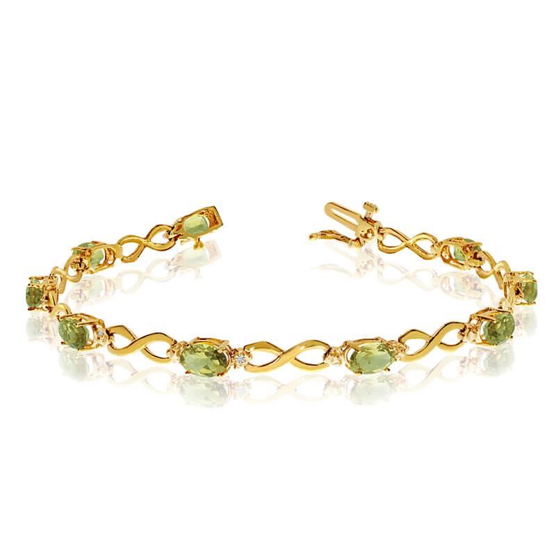 JCX3112: This 14k yellow gold oval peridot and diamond bracelet features nine 6x4 mm stunning natural peridot stones with a 3.60 ct total gem weight.