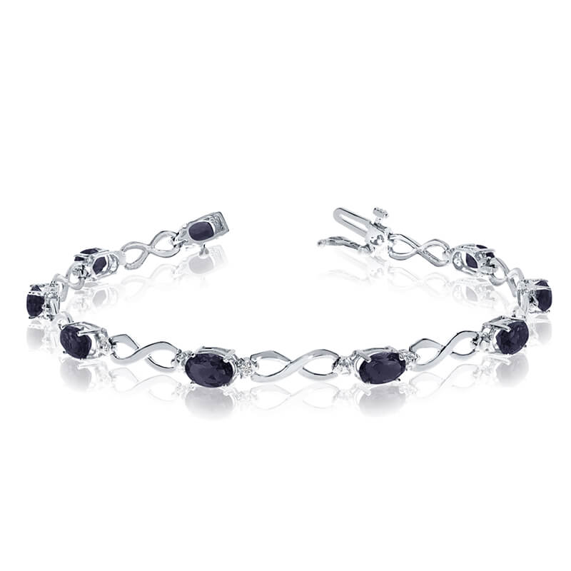 JCX3124: This 14k white gold oval sapphire and diamond bracelet features nine 6x4 mm stunning natural sapphire stones with a 3.51 ct total gem weight.