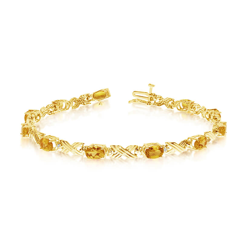This 10k yellow gold oval citrine and diamond bracelet features eleven 6x4 mm stunning natural citrine stones with a 3.41 ct total gem weight.