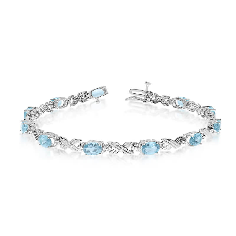 JCX3141: This 10k white gold oval aquamarine and diamond bracelet features eleven 6x4 mm stunning natural aquamarine stones with a 3.19 ct total gem weight.