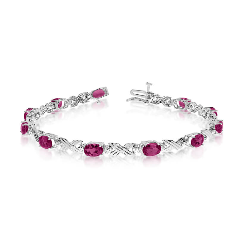 JCX3143: This 10k white gold oval ruby and diamond bracelet features eleven 6x4 mm stunning natural ruby stones with a 3.96 ct total gem weight.
