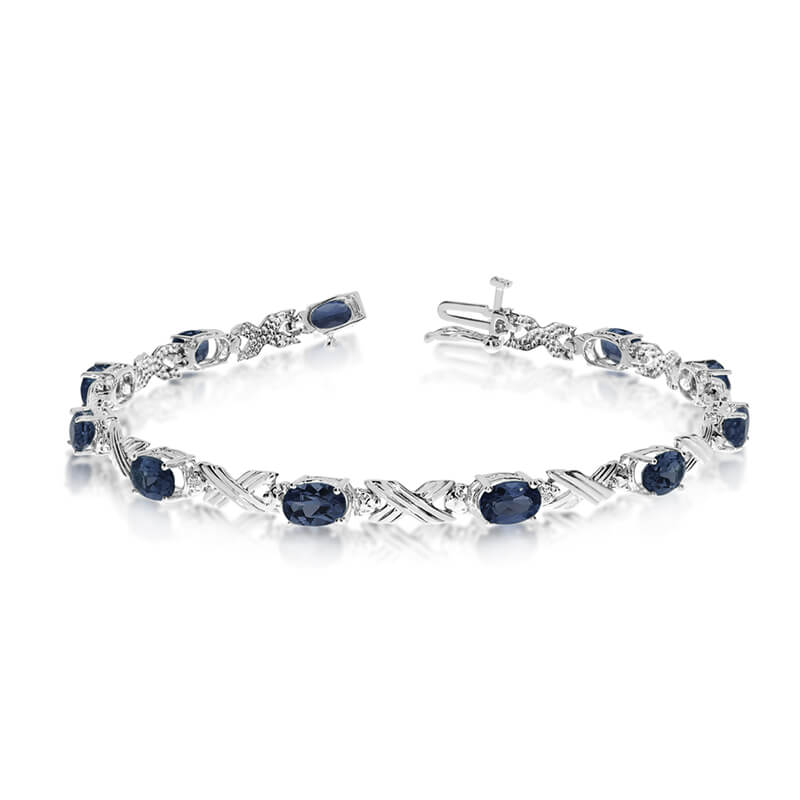 JCX3145: This 10k white gold oval sapphire and diamond bracelet features eleven 6x4 mm stunning natural sapphire stones with a 4.29 ct total gem weight.