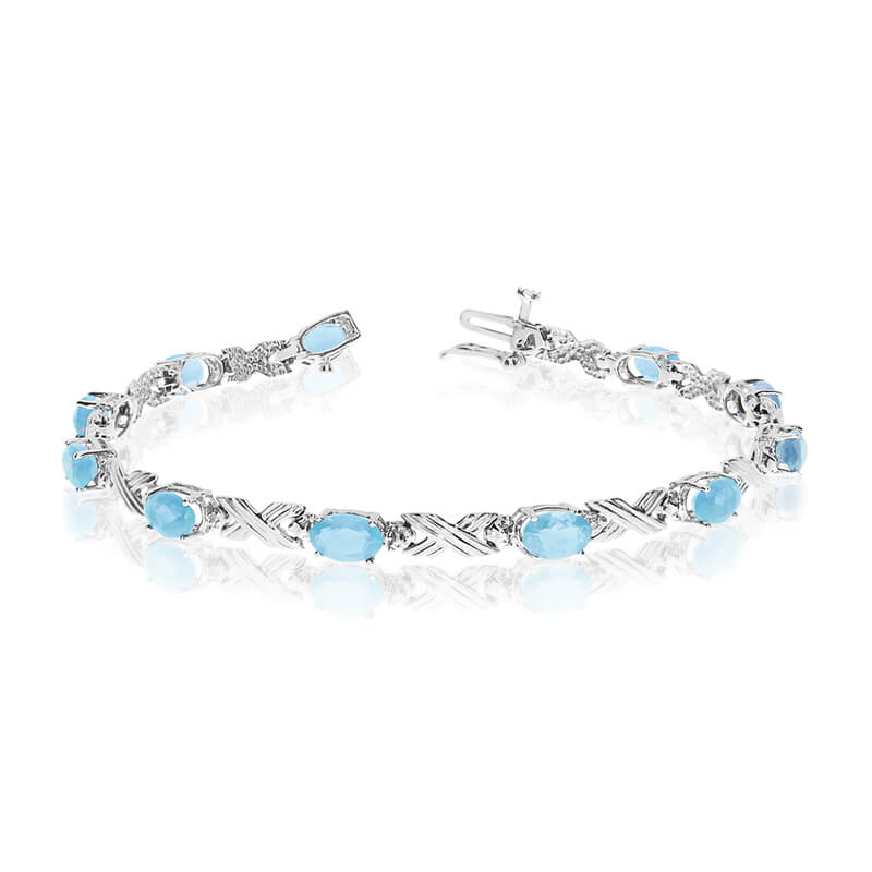 JCX3163: This 14k white gold oval aquamarine and diamond bracelet features eleven 6x4 mm stunning natural aquamarine stones with a 3.19 ct total gem weight.