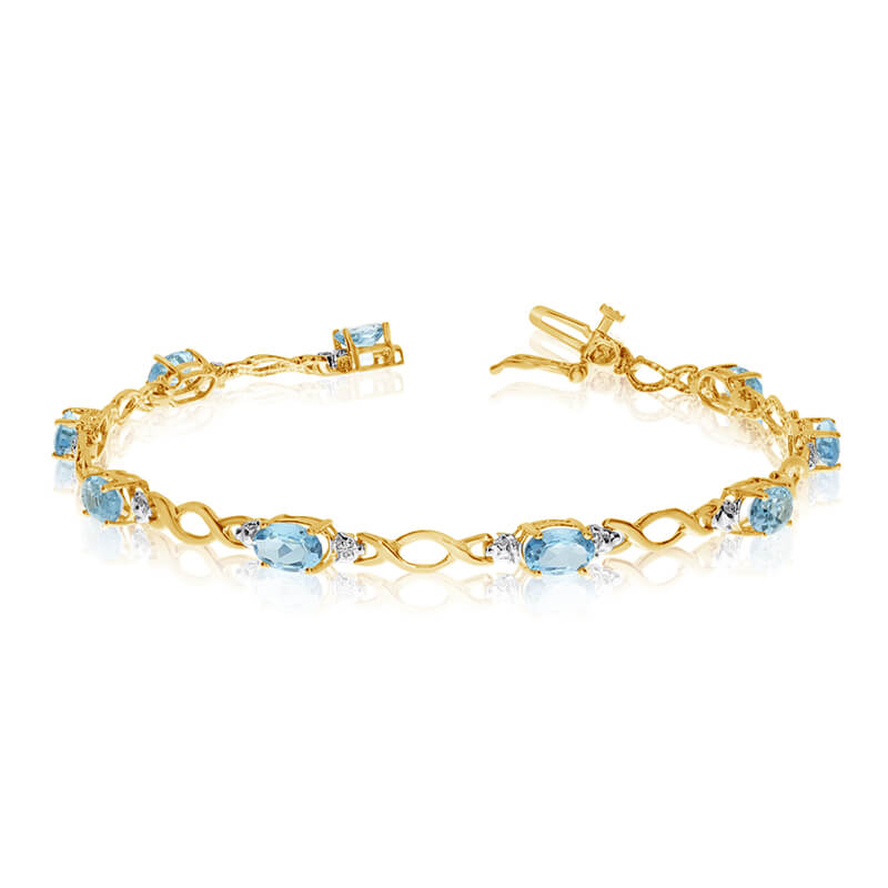 JCX3174: This 10k yellow gold oval aquamarine and diamond bracelet features ten 6x4 mm stunning natural aquamarine stones with 2.90 ct total gem weight.