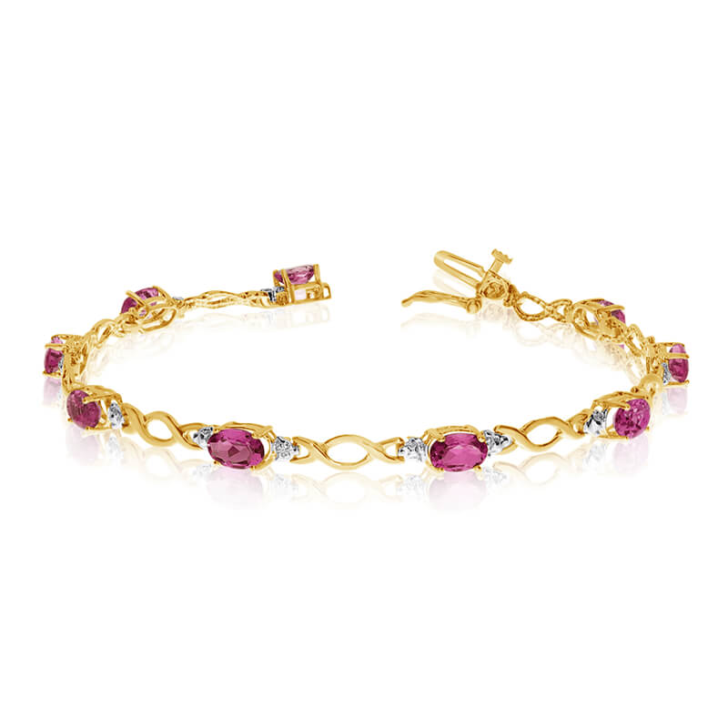 JCX3176: This 10k yellow gold oval ruby and diamond bracelet features ten 6x4 mm stunning natural ruby stones with 3.60 ct total gem weight.