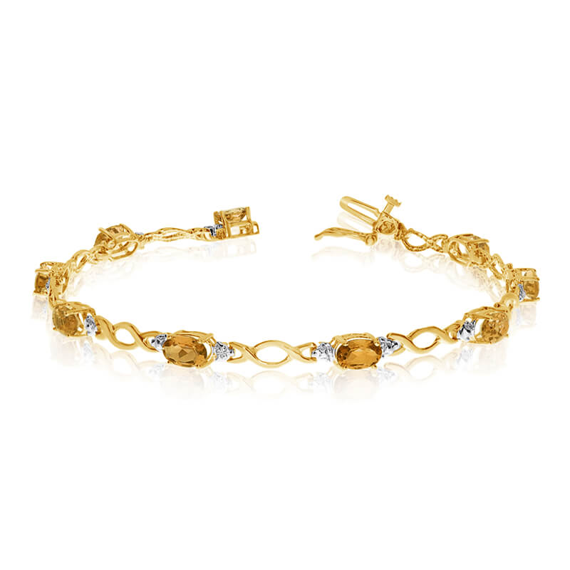 JCX3180: This 10k yellow gold oval citrine and diamond bracelet features ten 6x4 mm stunning natural citrine stones with a 3.10 ct total gem weight.
