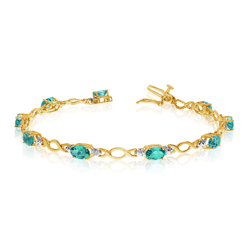 JCX3189: This 14k yellow gold oval emerald and diamond bracelet features ten 6x4 mm stunning natural emerald stones with a 3.10 ct total gem weight.