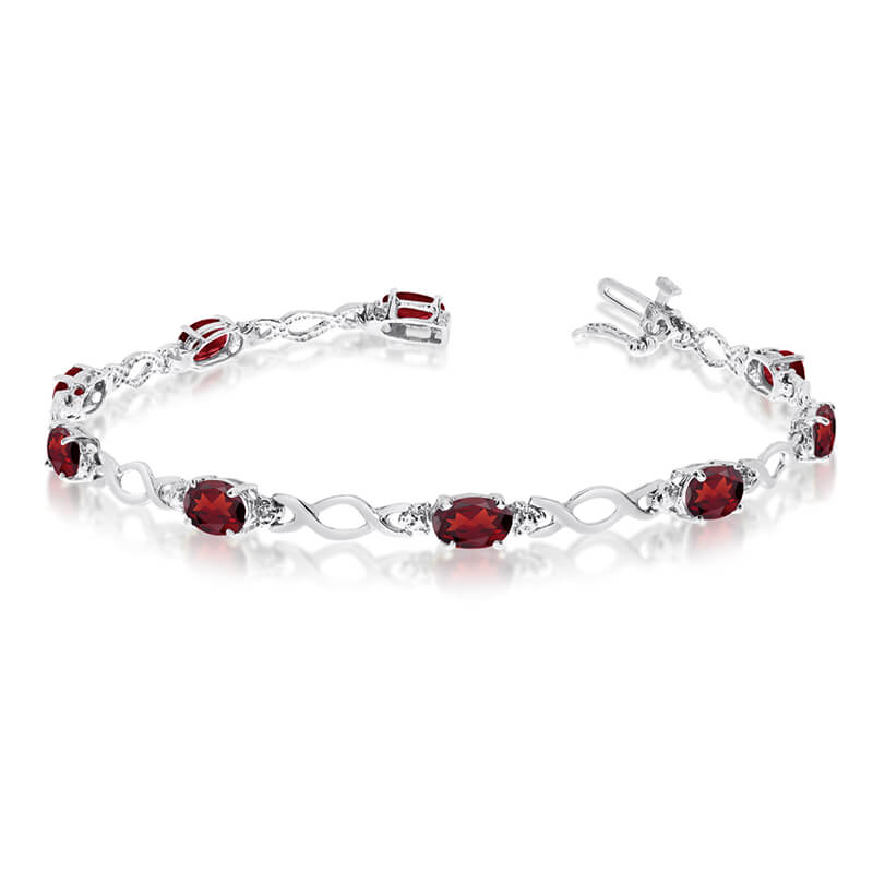 JCX3197: This 14k white gold oval garnet and diamond bracelet features ten 6x4 mm stunning natural garnet stones with a 4.70 ct total gem weight.