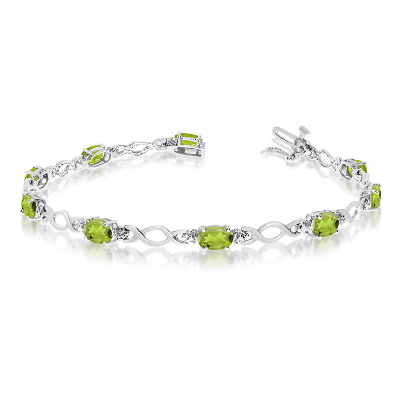 JCX3198: This 14k white gold oval peridot and diamond bracelet features ten 6x4 mm stunning natural peridot stones with 4.00 ct total gem weight.