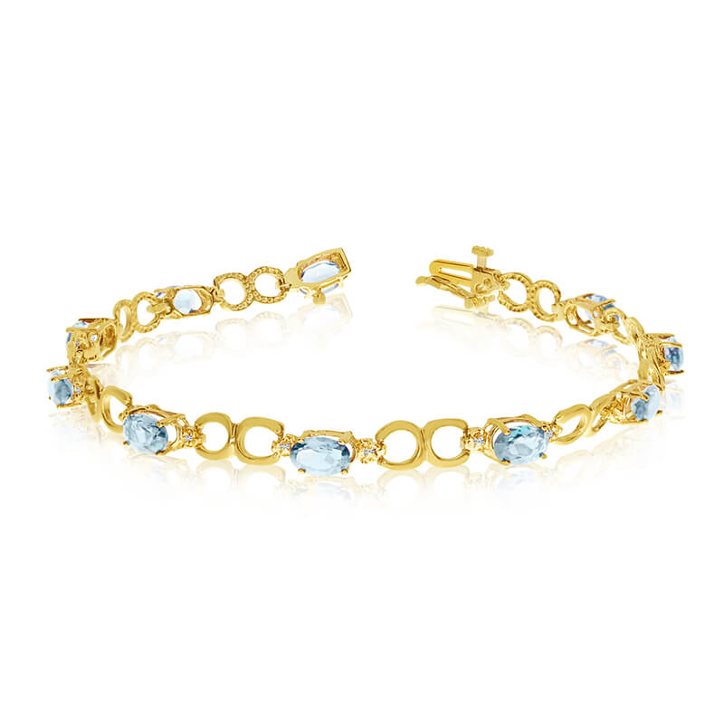 This 10k yellow gold oval aquamarine and diamond bracelet features ten 6x4 mm stunning natural aquamarine stones with 2.90 ct total gem weight.