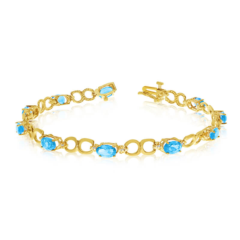 JCX3209: This 10k yellow gold oval blue topaz and diamond bracelet features ten 6x4 mm stunning natural blue topaz stones with a 4.00 ct total gem weight.