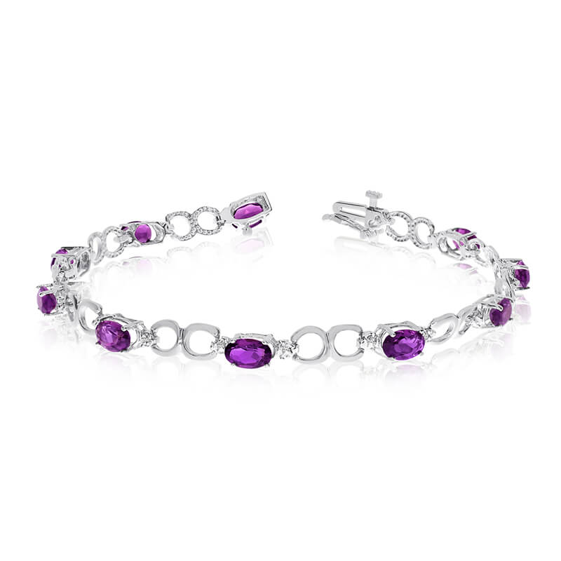 JCX3212: This 10k white gold oval amethyst and diamond bracelet features ten 6x4 mm stunning natural amethyst stones with a 3.40 ct total gem weight.