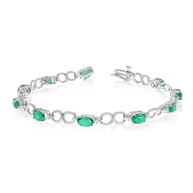 This 10k white gold oval emerald and diamond bracelet features ten 6x4 mm stunning natural emerald stones with a 3.10 ct total gem weight.