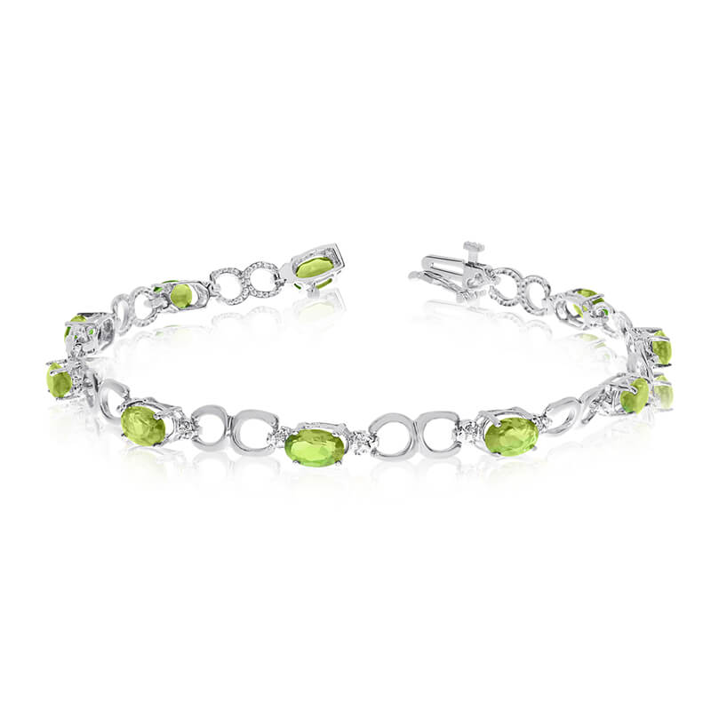 This 10k white gold oval peridot and diamond bracelet features ten 6x4 mm stunning natural peridot stones with 4.00 ct total gem weight.