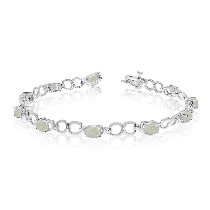 JCX3218: This 10k white gold oval opal and diamond bracelet features ten 6x4 mm stunning natural opal stones with a 1.90 ct total gem weight.