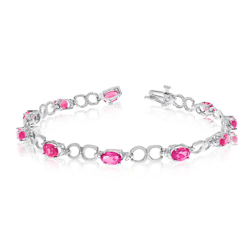 JCX3221: This 10k white gold oval pink topaz and diamond bracelet features ten 6x4 mm stunning natural pink topaz stones with a 4.30 ct total gem weight.