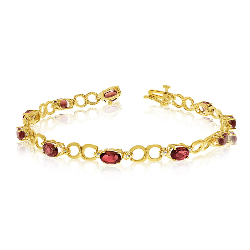 JCX3222: This 14k yellow gold oval garnet and diamond bracelet features ten 6x4 mm stunning natural garnet stones with a 4.70 ct total gem weight.