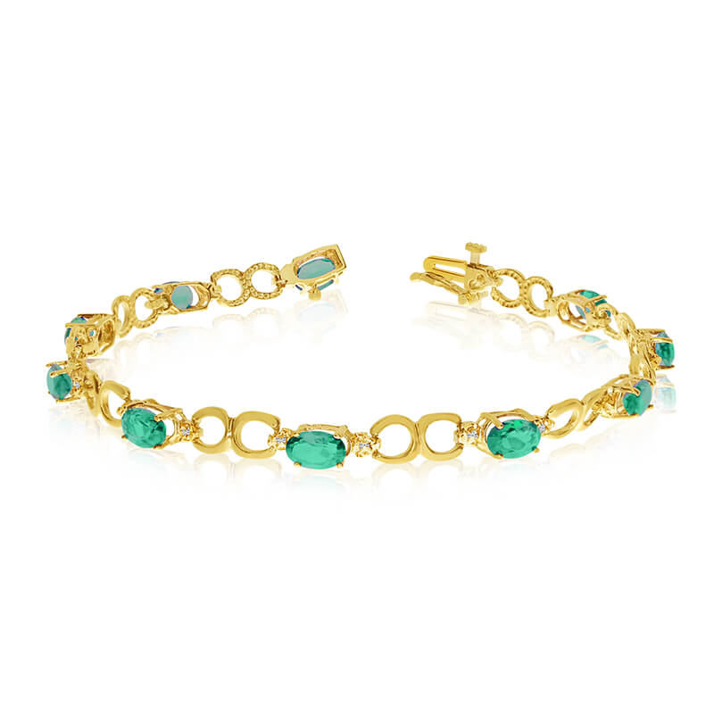 JCX3225: This 14k yellow gold oval emerald and diamond bracelet features ten 6x4 mm stunning natural emerald stones with a 3.10 ct total gem weight.