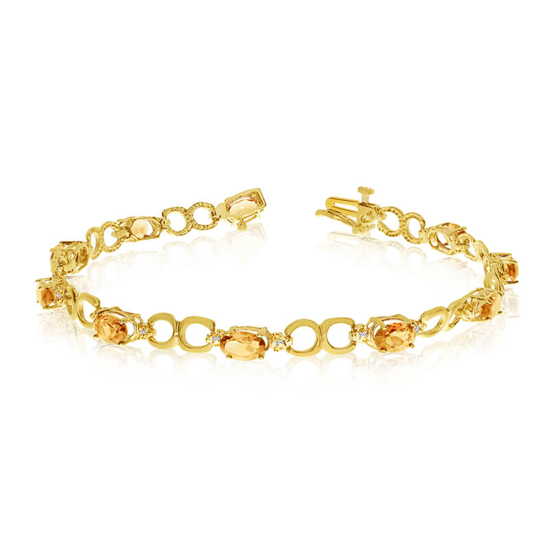 JCX3230: This 14k yellow gold oval citrine and diamond bracelet features ten 6x4 mm stunning natural citrine stones with a 3.10 ct total gem weight.