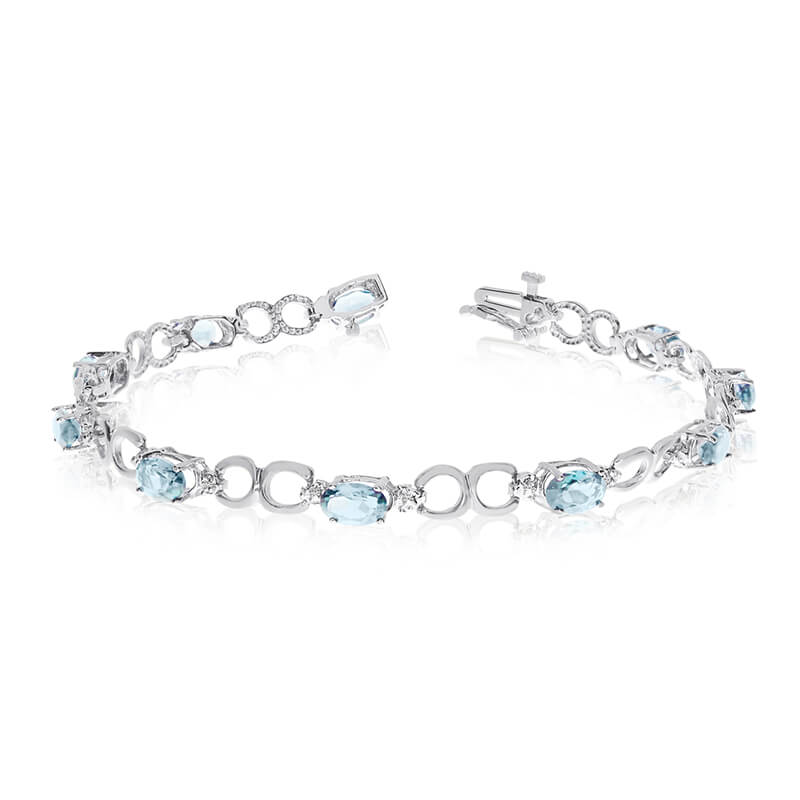 JCX3235: This 14k white gold oval aquamarine and diamond bracelet features ten 6x4 mm stunning natural aquamarine stones with 2.90 ct total gem weight.