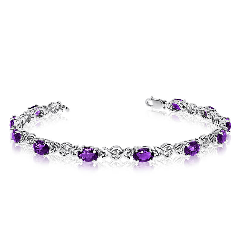 JCX3259: This 10k white gold oval amethyst and diamond bracelet features eleven 6x4 mm stunning natural amethyst stones with a 3.74 ct total gem weight.