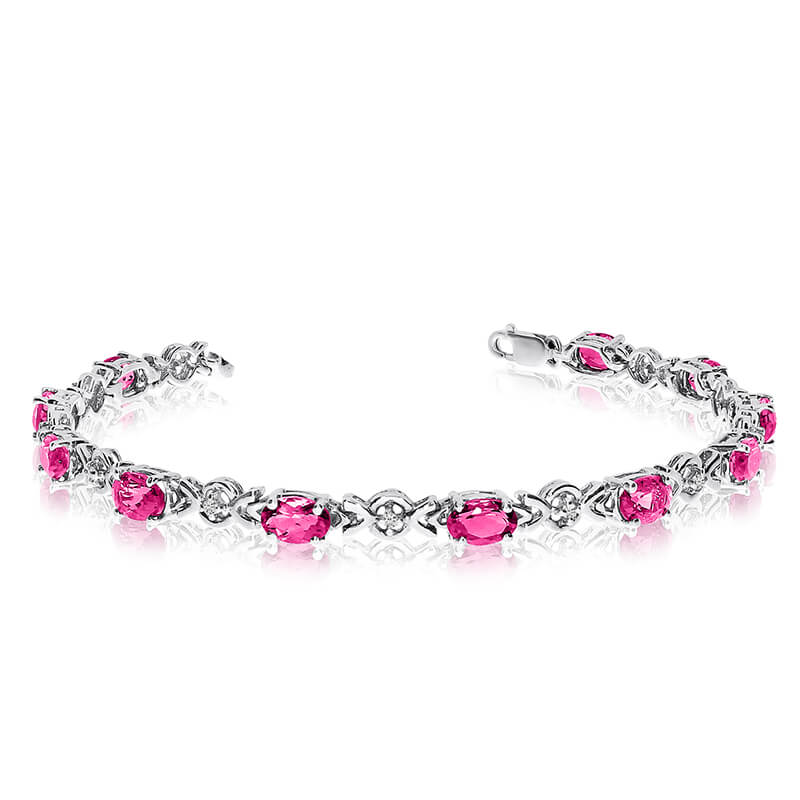 This 10k white gold oval pink topaz and diamond bracelet features eleven 6x4 mm stunning natural pink topaz stones with a 4.73 ct total gem weight.