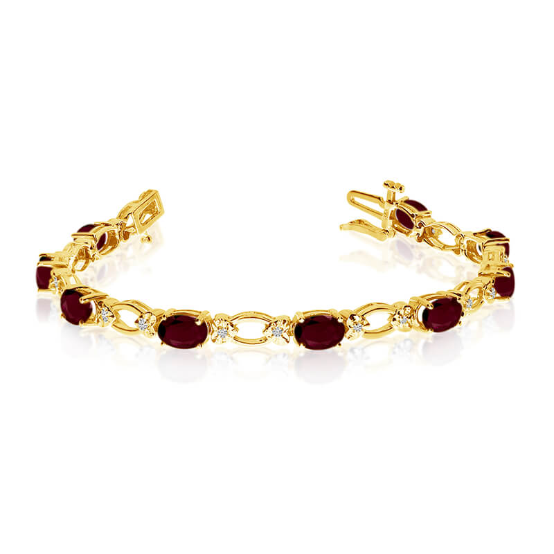 JCX3286: This 14k yellow gold natural garnet and diamond tennis bracelet features 12 oval garnets with a total gem weight of 5.64 carats and a total diamond weight of 0.12 carats.