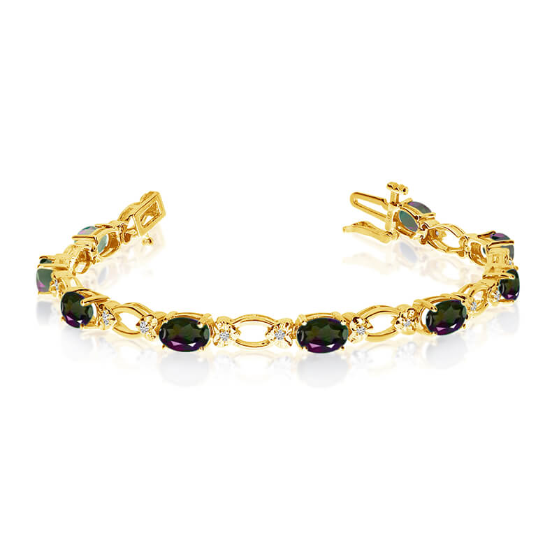 This 14k yellow gold natural mystic topaz and diamond tennis bracelet features 12 oval all natural mystic topaz. and a total diamond weight of 0.12 carats.