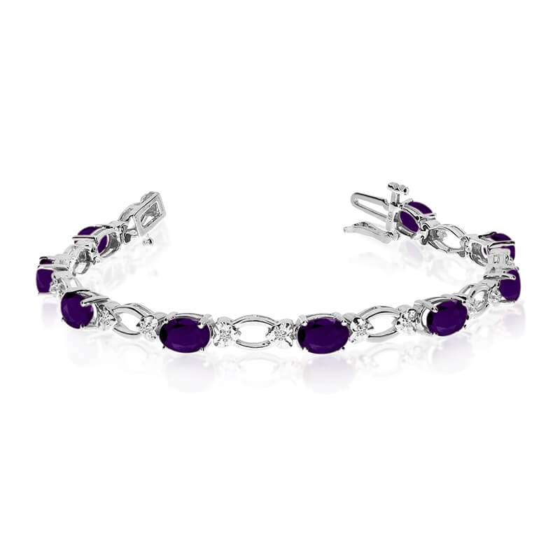 This 14k white gold natural amethyst and diamond tennis bracelet features 12 oval amethysts with a total gem weight of 4.08 carats and a total diamond weight of 0.12 carats.