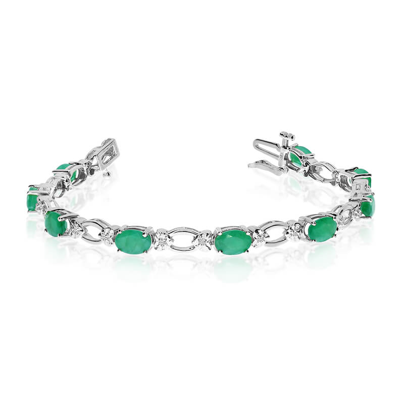 JCX3301: This 14k white gold natural emerald and diamond tennis bracelet features 12 oval emeralds with a total gem weight of 3.72 carats and a total diamond weight of 0.12 carats.