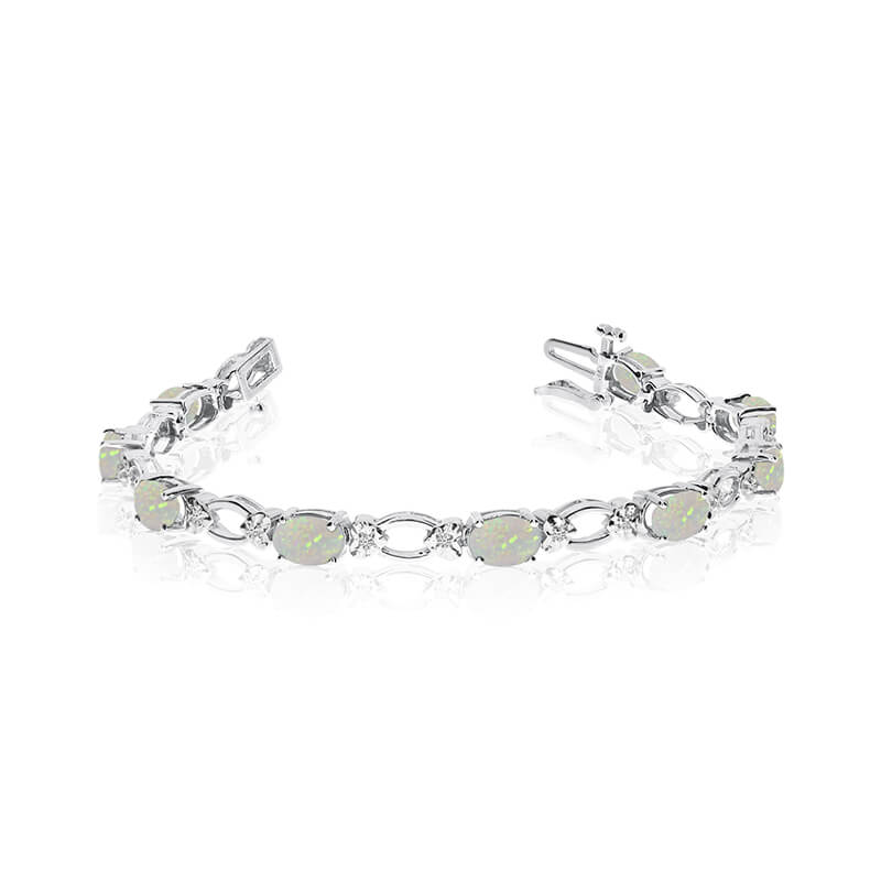 This 14k white gold natural opal and diamond tennis bracelet features 12 oval opals with a total gem weight of 2.28 carats and a total diamond weight of 0.12 carats.