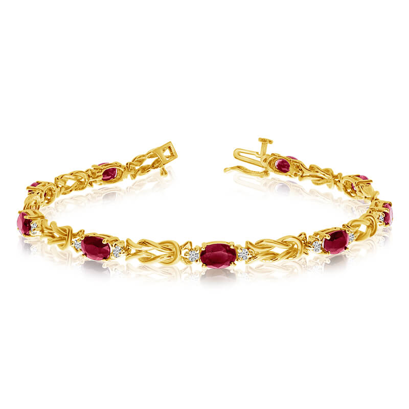 JCX3310: This 14k yellow gold natural garnet and diamond tennis bracelet features 9 oval garnets with a total gem weight of 4.23 carats and a total diamond weight of 0.5 carats.