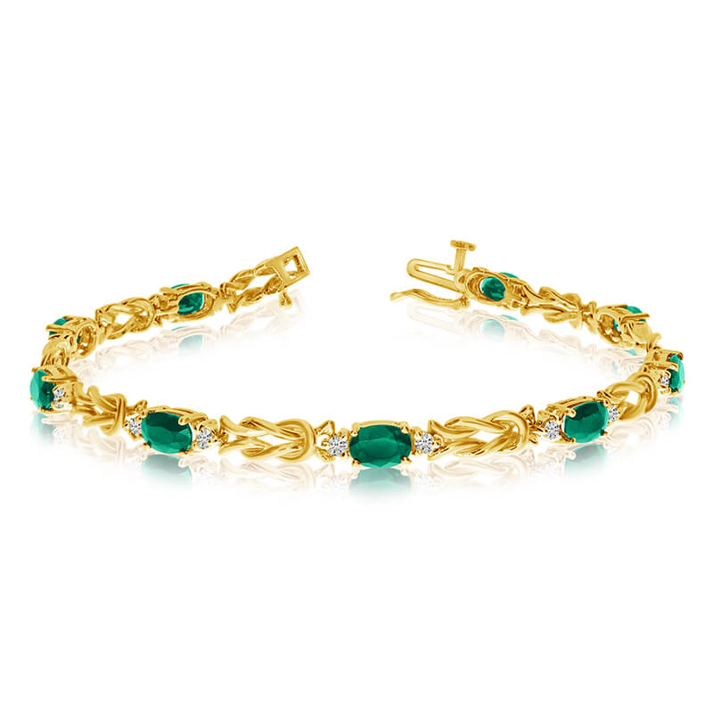 JCX3313: This 14k yellow gold natural emerald and diamond tennis bracelet features 9 oval emeralds with a total gem weight of 2.79 carats and a total diamond weight of 0.5 carats.