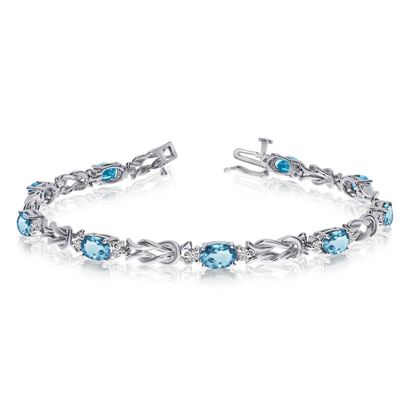 This 14k white gold natural aquamarine and diamond tennis bracelet features 9 oval aquamarines with a total gem weight of 2.61 carats and a total diamond weight of 0.5 carats.