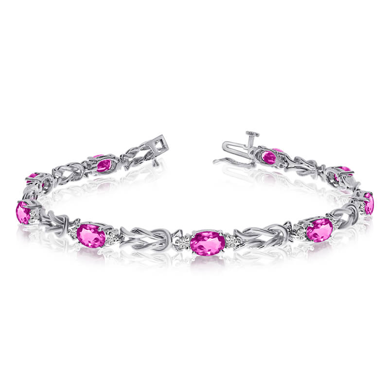 JCX3333: This 14k white gold natural pink-topaz and diamond tennis bracelet features 9 oval pink-topazs with a total gem weight of 3.87 carats and a total diamond weight of 0.5 carats.